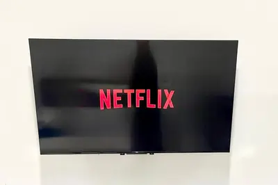 a television with the netflix logo on the screen at Silver Blu APT - Beachside - Location - Office in Limassol