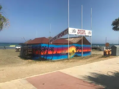a building with a painting on it on the beach at Queen victoria sea view apartments in Larnaka