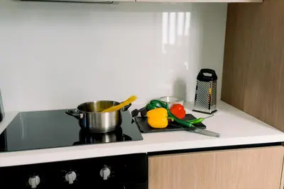 a kitchen counter with a pot on a stove at Nesea Seaside Luxury Escape in Paralimni