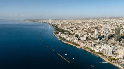 an aerial view of a city next to the water at Beach Front View Apartment Sea Pool & Prime Location in Limassol