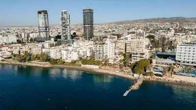 an aerial view of a city and a body of water at Beach Front View Apartment Sea Pool & Prime Location in Limassol