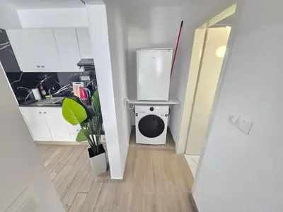 a small kitchen with a washing machine in a room at 1 bedroom, Agia Napa 1 - C in Ayia Napa