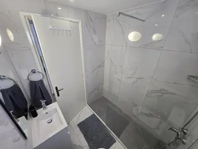 a bathroom with a shower with a glass door at 1 bedroom, Agia Napa 1 - C in Ayia Napa