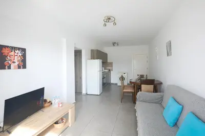 a living room with a couch and a table at Napa Apollo 's Nest in Ayia Napa