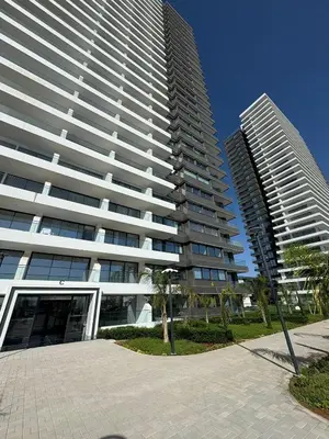 two tall buildings with palm trees in front of them at Super Luxury 1 bedroom apartment on 27th floor in Grand Sapphire in Phrenaros