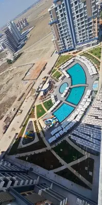 an aerial view of a resort with a pool and buildings at Riverside studio in Iskele in Dherinia