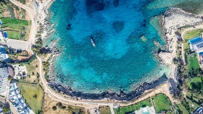 an aerial view of a beach with blue water at Beachfront Seaview Apartment in Paralimni