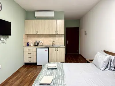 a room with a bed and a kitchen with a sink at Room in EkinAdademir Dorm North Cyprus in Nicosia