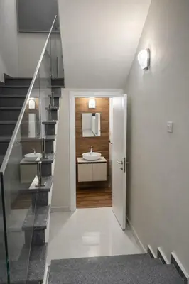 a bathroom with a sink and a staircase at Bohemian City Escape Villa in Nicosia