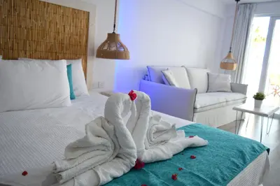 a room with a bed with towels on it at Seaside Stay Room in Ayia Napa