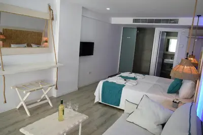 a small room with a bed and a couch at Seaside Stay Room in Ayia Napa