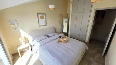 a bedroom with a bed with a basket on it at 3BR Shared Apt - Beach 7-min walk, Peaceful in Larnaka