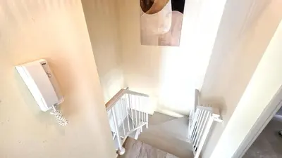 a staircase with a urinal on the wall at 3BR Shared Apt - Beach 7-min walk, Peaceful in Larnaka