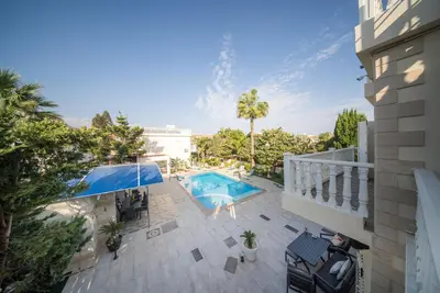 an overhead view of a swimming pool on a balcony at The Nissi Duo Collection in Ayia Napa