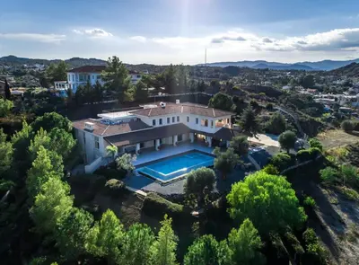 an aerial view of a house with a swimming pool at Epavli Papadopoulou - Luxury Villa - Pool & Garden in Kornos