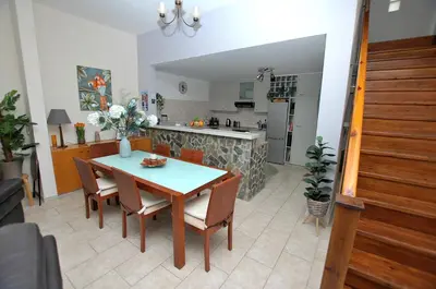 a kitchen and dining room with a table and chairs at Villa Acanthus in Pissouri