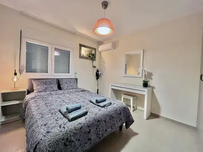 a bedroom with a bed with two towels on it at Monte Napa Moments in Ayia Napa