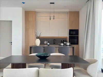a kitchen and dining room with a table and chairs at Stasikratous Residence - 10th Floor Gym in Nicosia