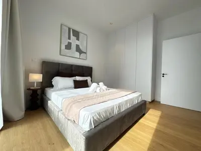 a bedroom with a large bed in a room at Stasikratous Residence - 10th Floor Gym in Nicosia