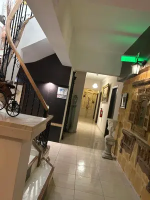 a hallway of a building with a staircase and a stair case at Kipros Accommodation in Nicosia