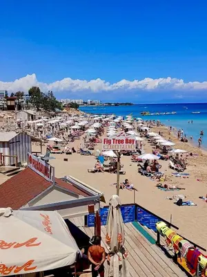 a beach with a lot of people on it at Protaras Sol 2 Bedroom Holiday Let Apartment in Protaras