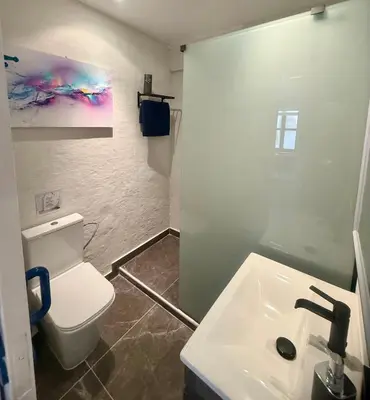 a bathroom with a white toilet and a sink at Protaras Sol 2 Bedroom Holiday Let Apartment in Protaras