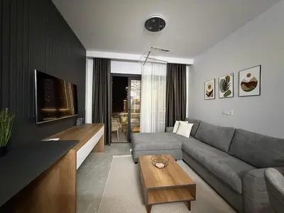 a living room with a couch and a table at Riverside Life residence in Long Beach, Iskele, North Cyprus in Dherinia