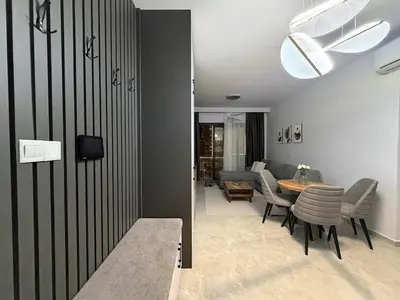 a living room with a table and a dining room at Riverside Life residence in Long Beach, Iskele, North Cyprus in Dherinia