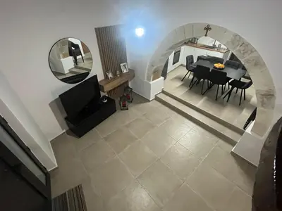 an overhead view of a dining room and living room at Το Αρχοντικόν in Ayvaryara