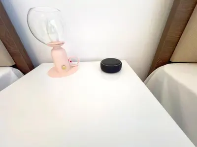 a table with a lamp on top of a bed at Marina Sea Breeze Apartment, Sleeps 8, Free Wi-Fi in Limassol