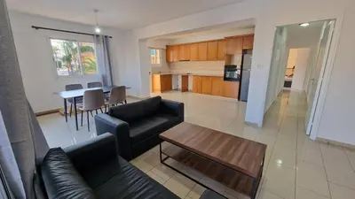 a living room with a couch and a table at Limassol Great in Limassol