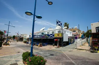 a street with a building on the side of a street at Flora Maria Hotel in Ayia Napa