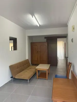 a living room with a couch and a table at Flora Maria Hotel in Ayia Napa