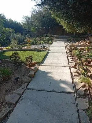 a walkway in a garden with a landscaping at Ζεν σπίτι in Limassol