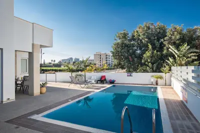 a swimming pool on the roof of a house at Flouressia Villa 4 in Protaras