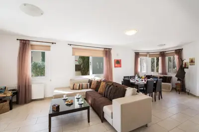 a living room with a couch and a table at Nancy Villas in Protaras