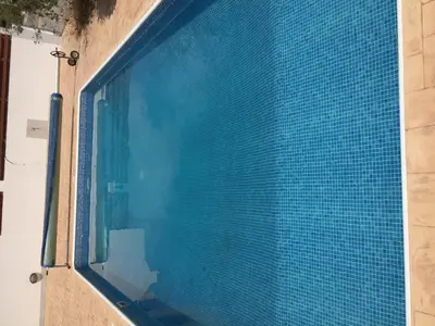 a view of a swimming pool through a window at Sol y Mar Malama Villa in Paralimni