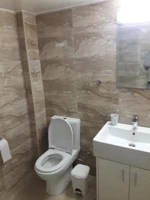 a bathroom with a toilet and a sink at P L Sunorama Beach Garden 302 in Larnaka