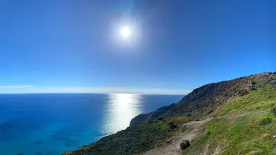 a view of the ocean from a cliff at Crowne Plaza Limassol by IHG in Limassol