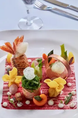 a plate of food on a table with food on it at Grecian Park in Protaras