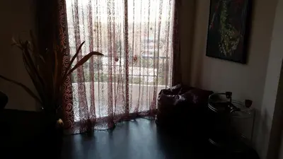 a room with a window with a curtain at Sylva Hotel in Limassol