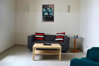 a living room with a couch and a coffee table at Chris House in Nicosia