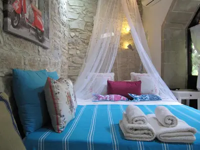 a bedroom with a bed with towels on it at Stratos ArtDeco House in Kalavasos