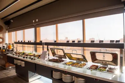 a buffet line with a lot of food on display at Rise Urban Art Hotel in Larnaka