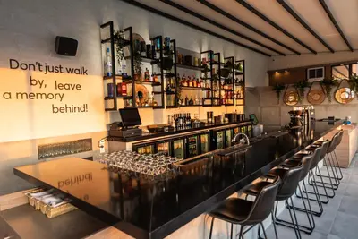 a bar with a lot of wine glasses at Rise Urban Art Hotel in Larnaka