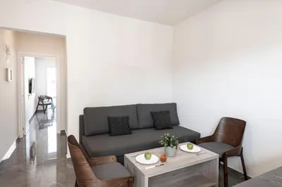 a living room with a couch and a table at Blazer Residence in Larnaka