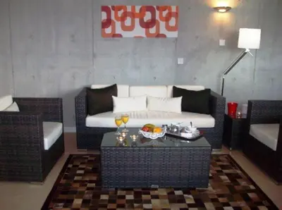 a living room with a couch and a coffee table at Allegra GSP Sport Center in Nicosia
