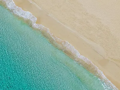 an overhead view of the beach and the ocean at Alion Beach Hotel in Ayia Napa
