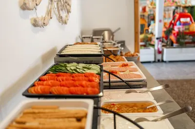 a buffet line with many different types of food at Blue Harbour Boutique in Ayia Napa