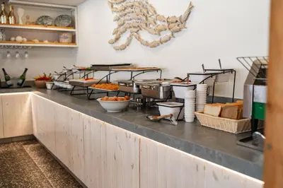 a buffet line with various food items on it at Blue Harbour Boutique in Ayia Napa